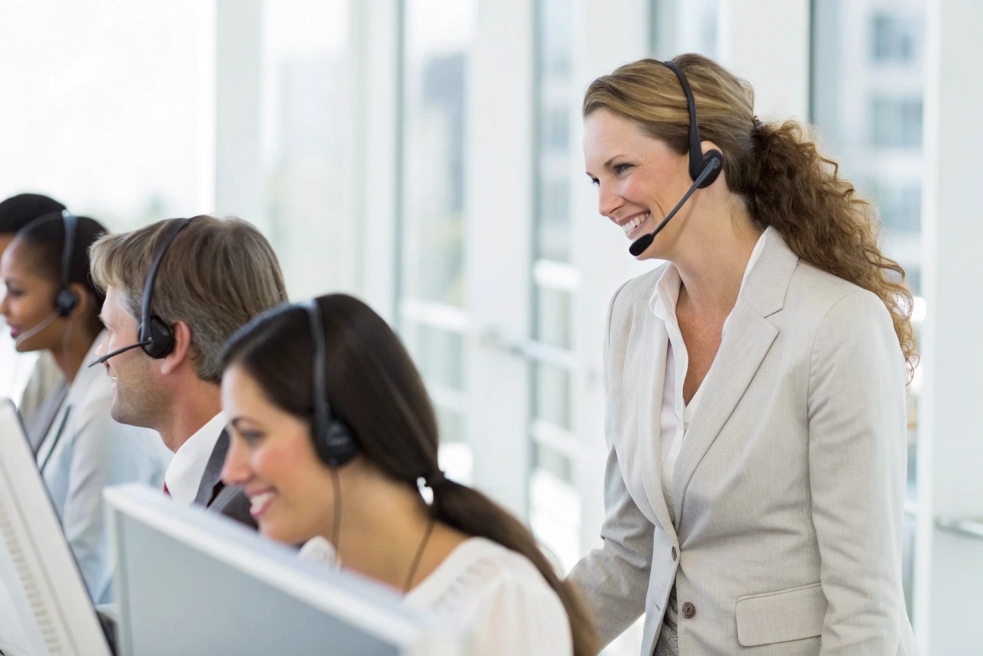 Group of call center agents working together in an office