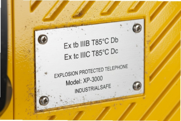 Close-up Ex nameplate on explosion-proof industrial telephone with ATEX markings