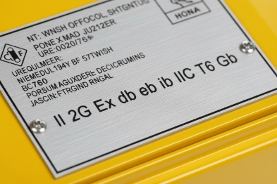 Close-up metal nameplate showing ATEX Ex marking for IIC T6 Gb explosion-proof device