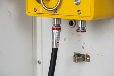 Sealed cable gland and connector detail on explosion-proof SIP phone for secure industrial wiring