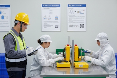 Factory inspection team testing explosion-proof SIP phones on production line quality check