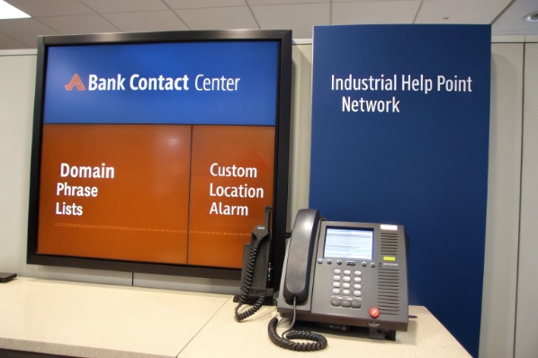 Bank contact center desk with VoIP help point phone