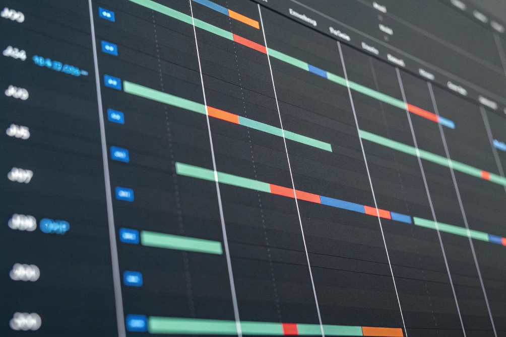 Operations dashboard screen with colored timeline bars monitoring network tasks and performance
